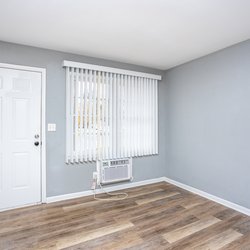 wood floor living room at Ashley Oaks Apartments located in Perry, GA