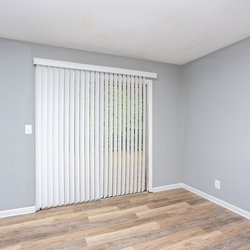 wood floor living room at Ashley Oaks Apartments located in Perry, GA